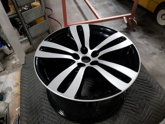 Jaguar wheels done in Metallic Silver and Gloss Black.