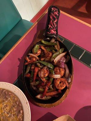 Shrimp fajita, meat and veggie portion. Comes with 4 tortillas wrapped the stay hot, fresh refried beans, and rice.