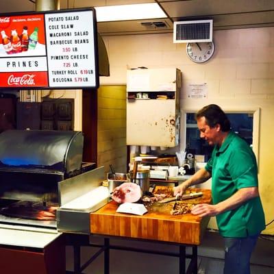 Mr. Prine hand chopping our sandwiches to order!