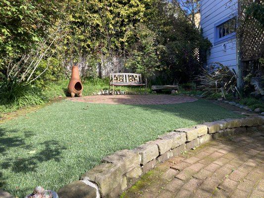 We replaced an old sod lawn with Astroturf & block edging with concrete in between.