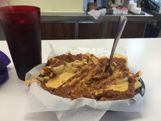 Large chili cheese fries and a pop.