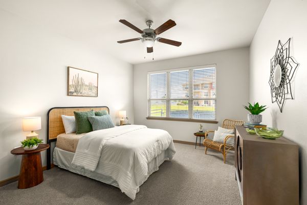 Bedroom with ceiling fan at Estates of Richardson