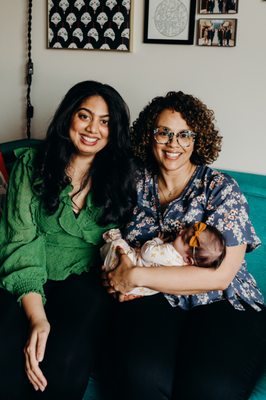 Photo of me, Cristina, and my daughter at her newborn photo shoot.