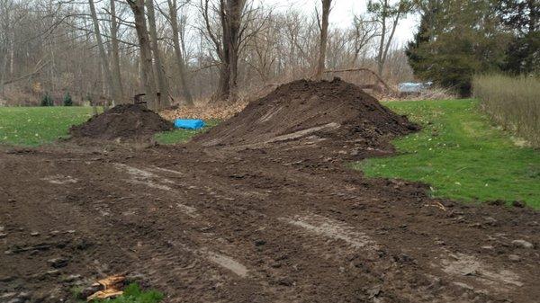 Excavated dirt neatly piled where requested