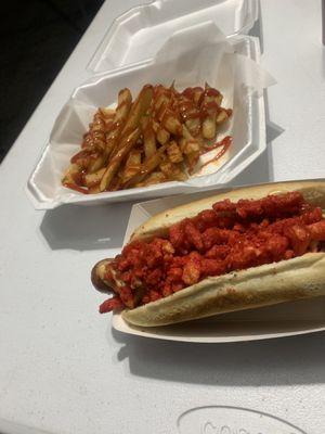 Our bacon wrapped hotdog and hot Cheetos with an extra order of fries