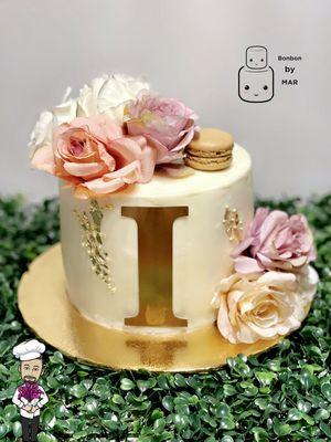 Initial buttercream cake with flowers