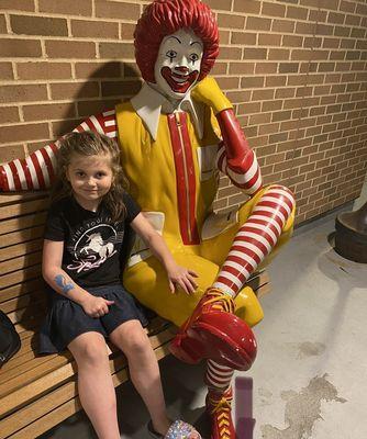 With her buddy, Ronald McDonald