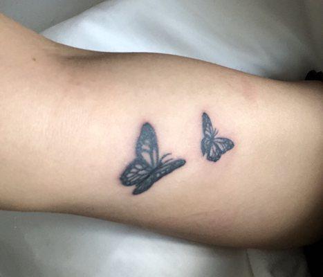 The smaller butterfly was the one she created and the larger one is the one she retouched.