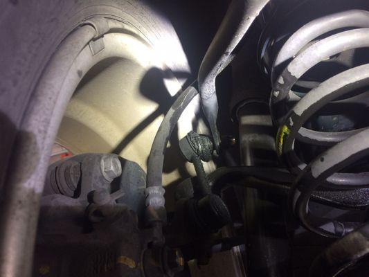 You can see how the flex hoses wee routed incorrectly. It should be between the rod and the spring.