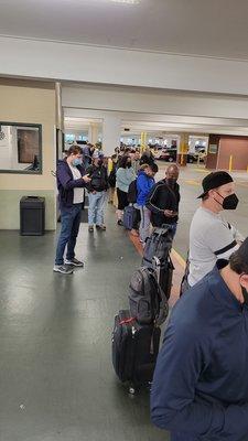 Line of people waiting for shuttle.