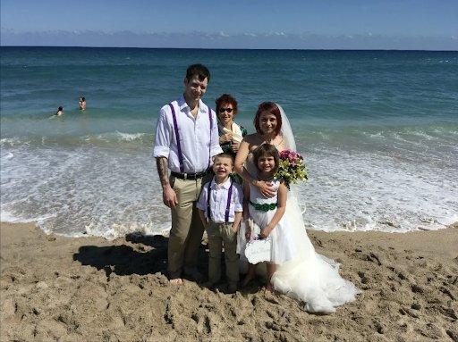 Beautiful family wedding ceremony on beach in Delray