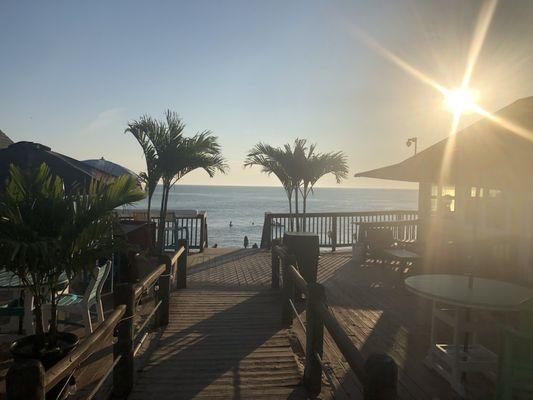 Walkway to the beach and Sunset Beach Bar and Grille