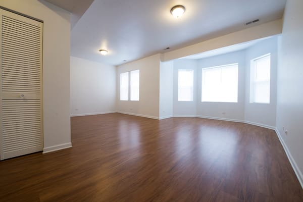 Gorgeous living room with tons of natural sunlight that can fit all your furniture