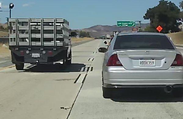 he cut off the honda driver and he took a photo of the truck.