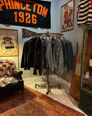 Men's denim jackets, leather jackets, leather club chair and art.