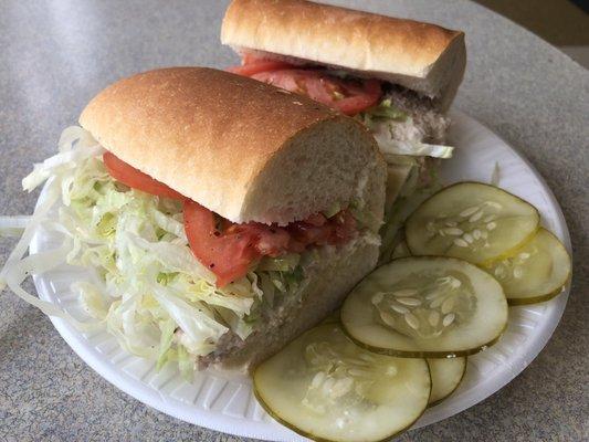 Tuna on white, side of pickle slices. Why not?