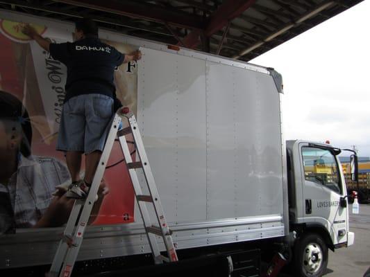 Kyle wrapping the Loves delivery truck