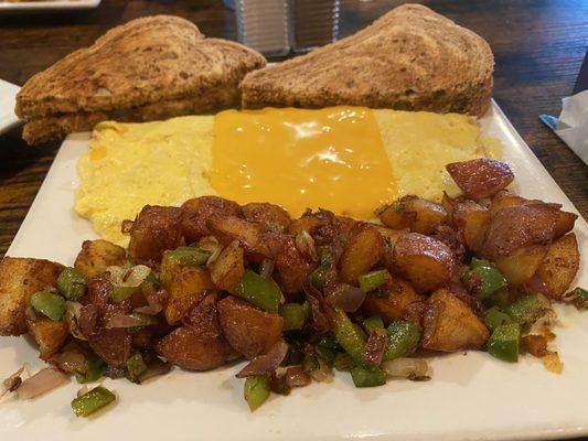 Cheese omelette. Home fries w/onions&peppers. Rye toast