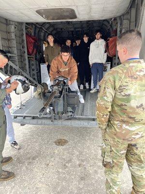 Future Airman getting the opportunity to experience the recoil of a machine gun "dry fire"