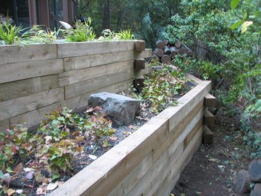 After photo of Bluestone patio and timber retaining wall. Lexington, MA.