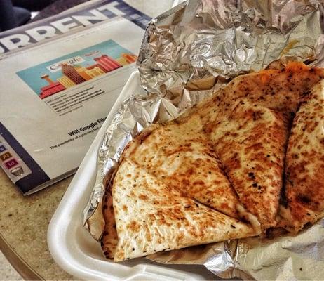 Cheese quesadilla with caramelized onions and bell peppers.