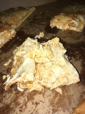 Inside their calzones.Cheese was chewy and not melted with a soft pizza crust..I could make a better calzone and not spend $12 for this.