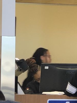 The rude and disgruntled DMV employee in the back. It's a poor photo but you should have an idea how she looks so you can avoid her lol.