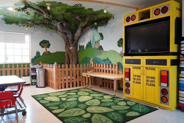 This is our movie and playtime area of our front room. We have a sensory swing, blocks, and puzzles to play with here.