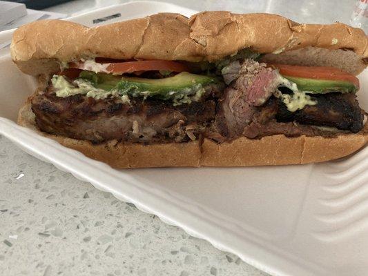 Mowich-carne asada, avocado, tomato, jalapeño dressing, beans, quest fresco