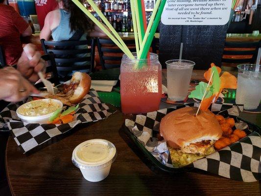 The candy apple  fishbowl,  chicken sandwich and ranch with sweet potato tots, chicken sandwich with cole slaw.