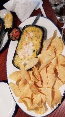 I believe this was Lobster shrimp and artichoke dip with house chips