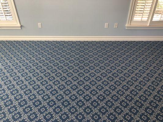 Woven Wilton carpet with hand sewn seam.