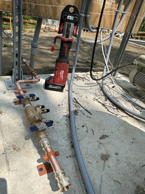 Installation of an irrigation back-flow preventer.