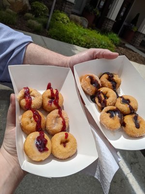 Donut bites with white chocolate and raspberry on one, and chocolate and caramel on the other. Delicious!