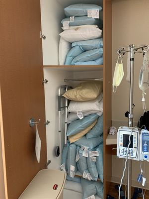 22 pillows taking up the space that was designed for patient use.