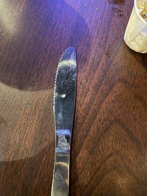 Unclean table and dirty knife