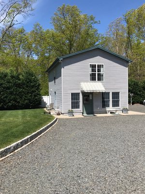 Our two story salon. The front door leads to the downstairs shop. A door on the right side of the shop leads to the main salon.