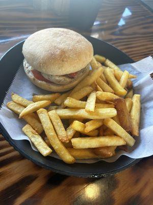 Grilled chicken sandwich with mayo and tomato, and fries