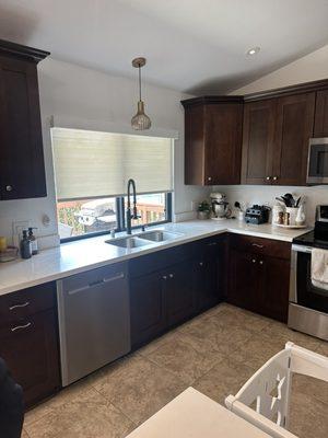 Roller shade over kitchen sink. To allow light also keep some privacy.