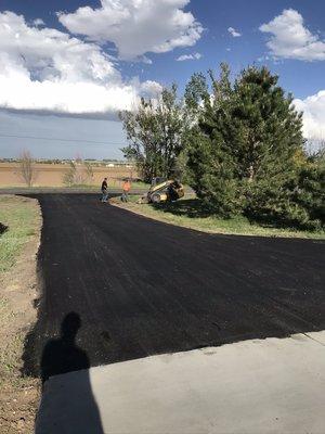 Remove old asphalt driveway and machine install new fresh asphalt.