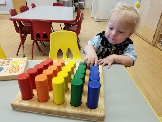 Trying out activities in the bigger kids' classroom.