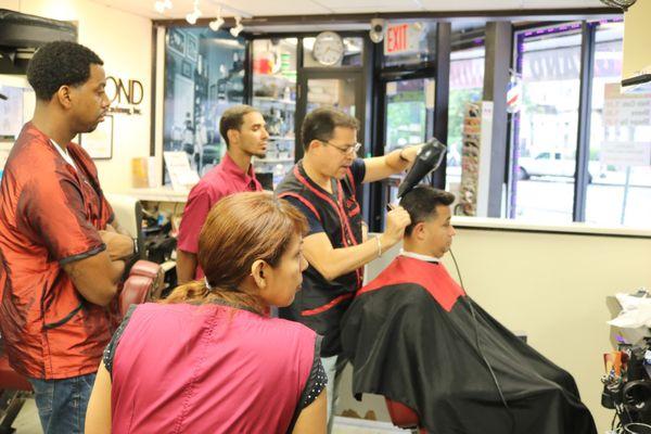 Javiel shows us techniques when using the dryer and brush and making the hair shape how we want it to be.