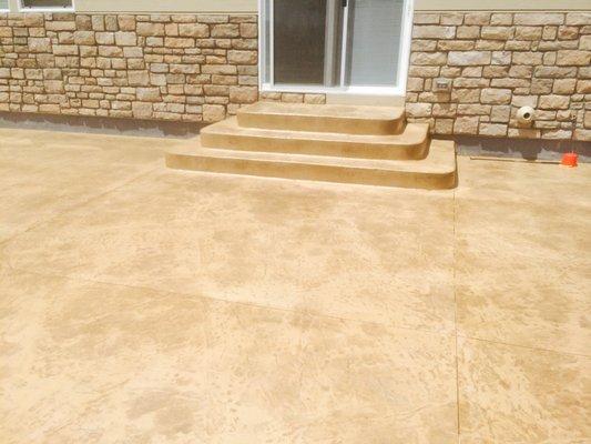 A Colored Concrete Patio Matches the look of your house!