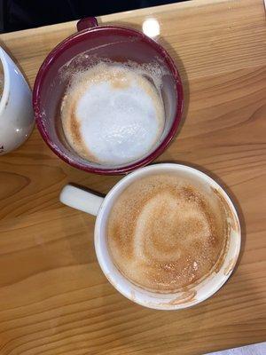 White mug: latte with toffee crunch and caramel  Red mug: cappuccino with toffee crunch and vanilla