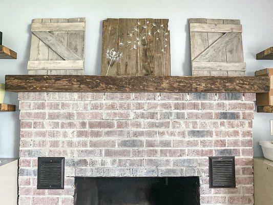 Replaced builder grade mantel with a 100 year old wooden beam.