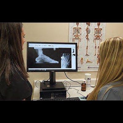 (left) Dr. Blanchet and Dr. Tendrich review digital x-rays taken in office