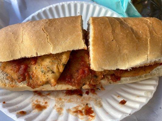 Chicken cutlet with marinara and red roasted peppers.