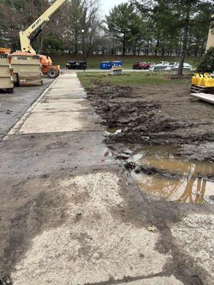 Mud flows freely over sidewalks