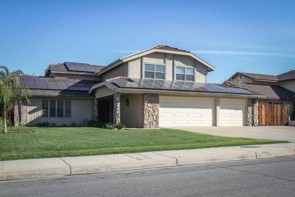 Solar panels came with this home to reduce electric bills and increase longer swimming season in sparkling pool.