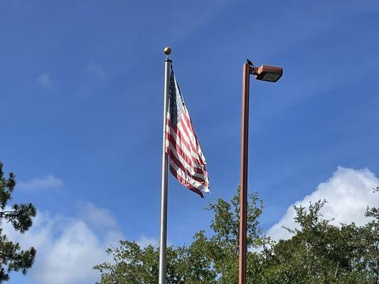 Tattered American flag needs to be replaced.